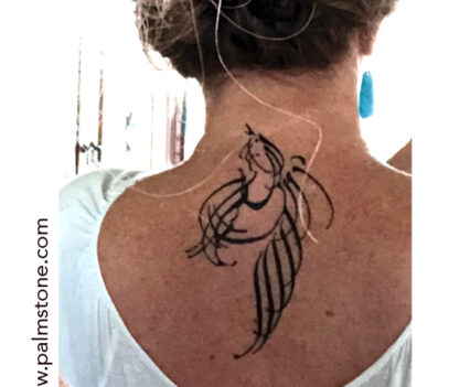 Bird in flight calligraphic back tattoo design